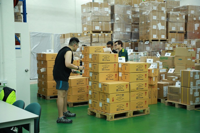 Hong Kong warehouse workers packing goods